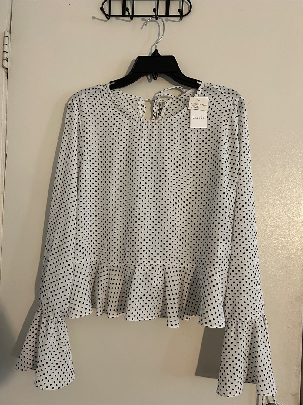 Elodie White Top with Black Polka Dots and Ruffle Hem